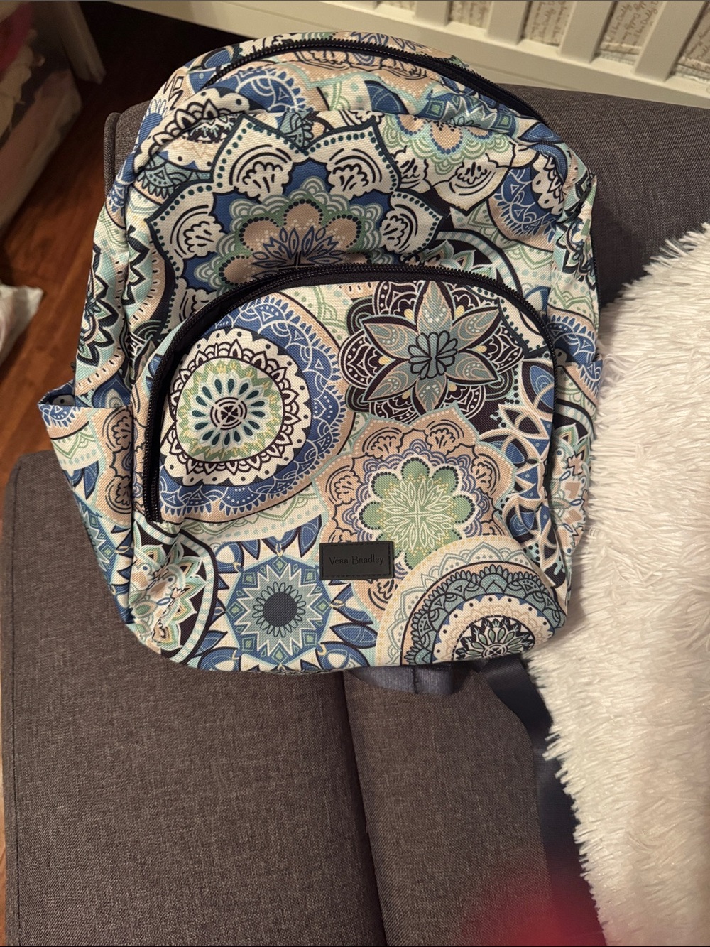 Patterned backpack on couch